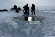 Two snowmobilers found dead beneath ice on northwestern B.C. lake